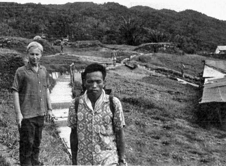  This photo of Dave Hollinshead, FIO at Ba Kelalan, was taken by OC C Company 1/2 GR.    The Indonesian border is over the ridge line in the background. 