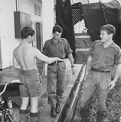  With shorts that conquered the empire, Gerry Caulfield shows Tony Shilcock how it should be done.  LCpl Tony Simpson (RE) appreciates Gerry's contribution. 