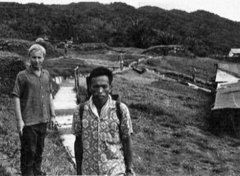  This photo of Dave Hollinshead, FIO at Ba Kelalan, was taken by OC C Company 1/2 GR.    The Indonesian border is over the ridge line in the background. 