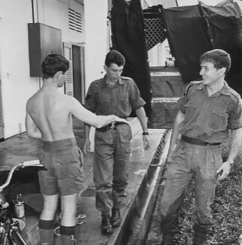  With shorts that conquered the empire, Gerry Caulfield shows Tony Shilcock how it should be done.  LCpl Tony Simpson (RE) appreciates Gerry's contribution. 